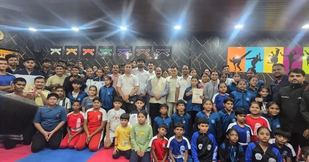 Academy family photo under the belt-rank wall