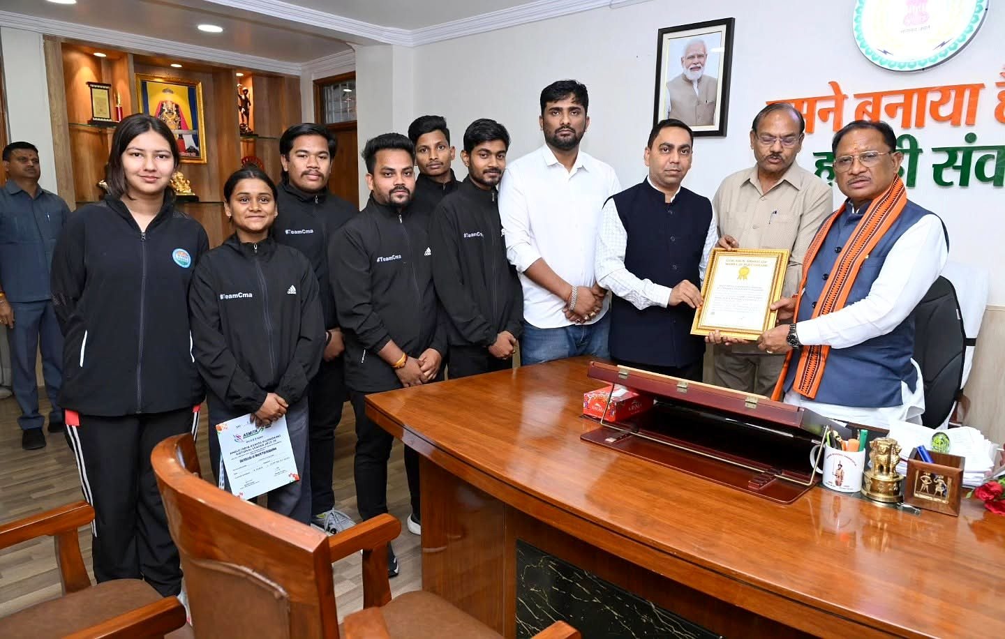 Team CMA receiving the Golden Book of World Records certificate