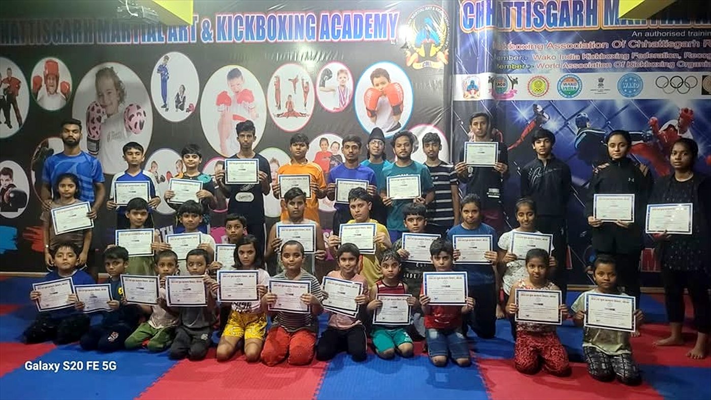 Students holding their grading certificates